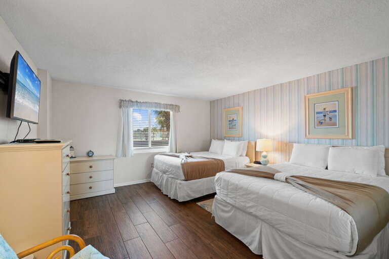 The spacious Guest Bedroom has two QUEEN beds and beautiful tile flooring. A REAL MUST SEE!! 