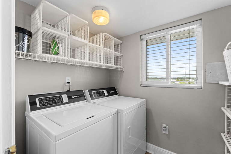 The laundry room is just off the kitchen for your convenience.