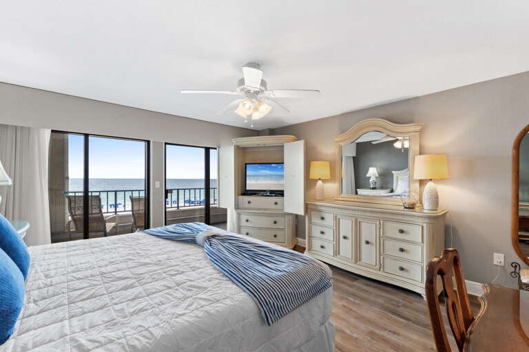 Large balcony doors really let the sights and sounds of the Gulf encompass all of this master bedroom.