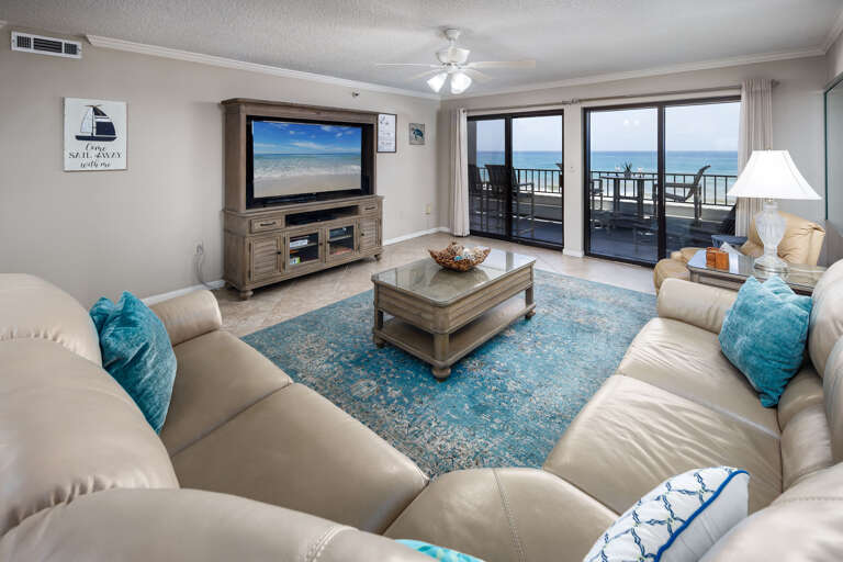 The living area is a great place for entertaining or relaxing. Glass doors lead directly to the 30' private balcony overlooking the beach.