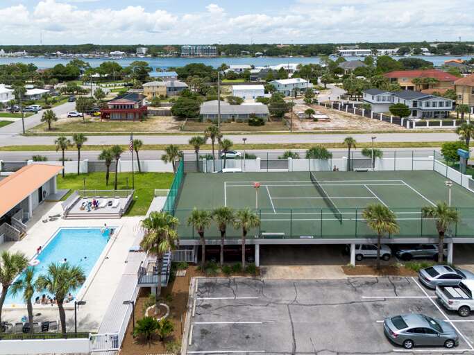 The Surf Dweller Condominiums features several amenities for your vacation: a refreshing pool, kiddie pool, tennis, barbeque grills, and of course, the beach!