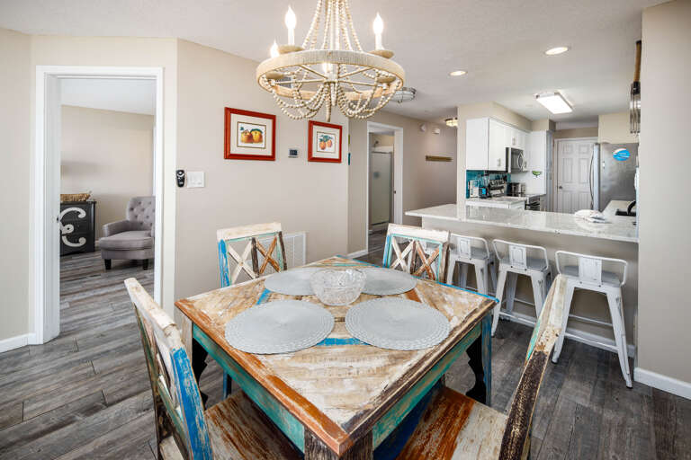 The dining room table sits 4 but there are more seats available at the breakfast bar