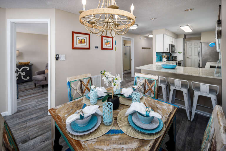 The dining room table sits 4 but there are more seats available at the kitchen island