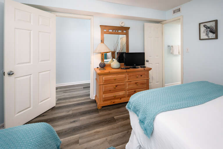 Contains a TV and spacious dresser for everyone's beach attire