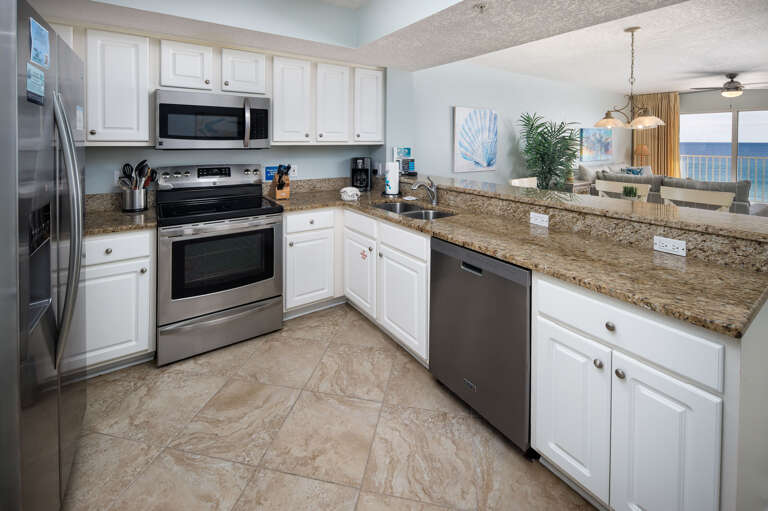 High end stainless steel appliances with side-by-side refrigerator