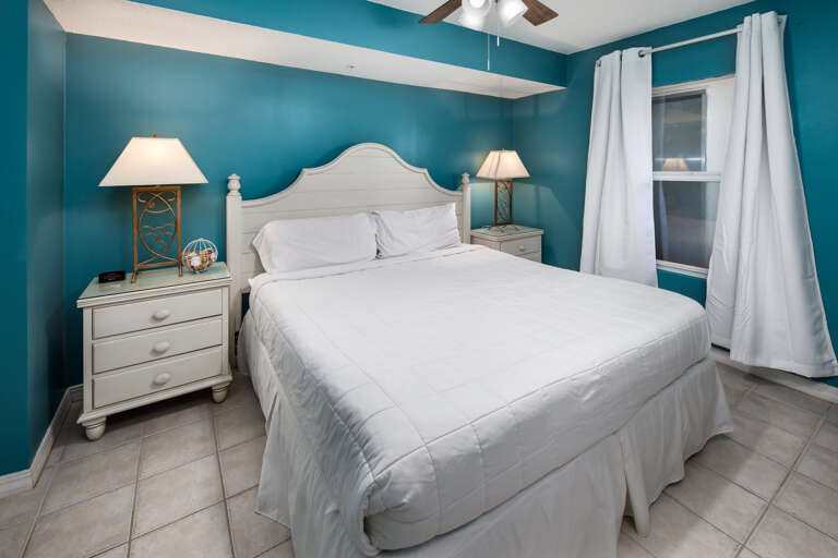 A king sized bad in this primary bedroom makes for a comfortable nights sleep A king sized bad in this primary bedroom makes for a comfortable nights sleep