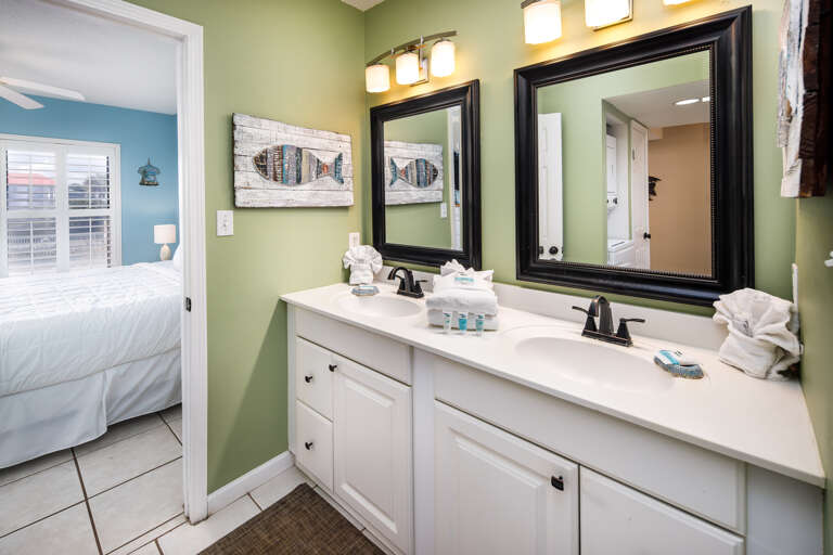 The updated vanity area of the bathroom provides a bright and clean look.