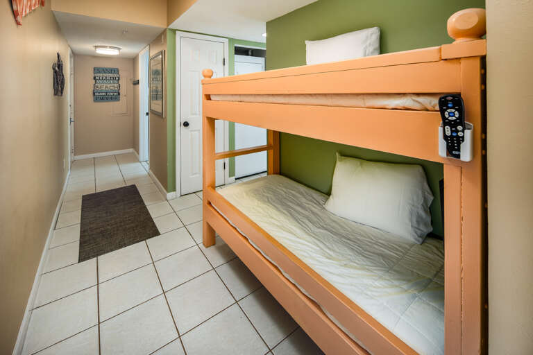 Bunk set in the hallway provides extra sleeping space for two children and flat screen TVs (top and bottom) with remote controls. Can't beat this awesome feature.