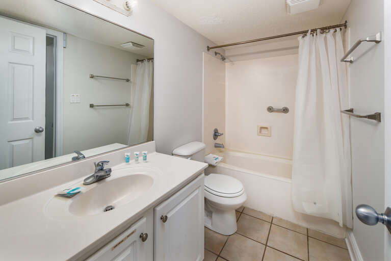 Guest bath is accessible by the hallway and the guest bedroom.