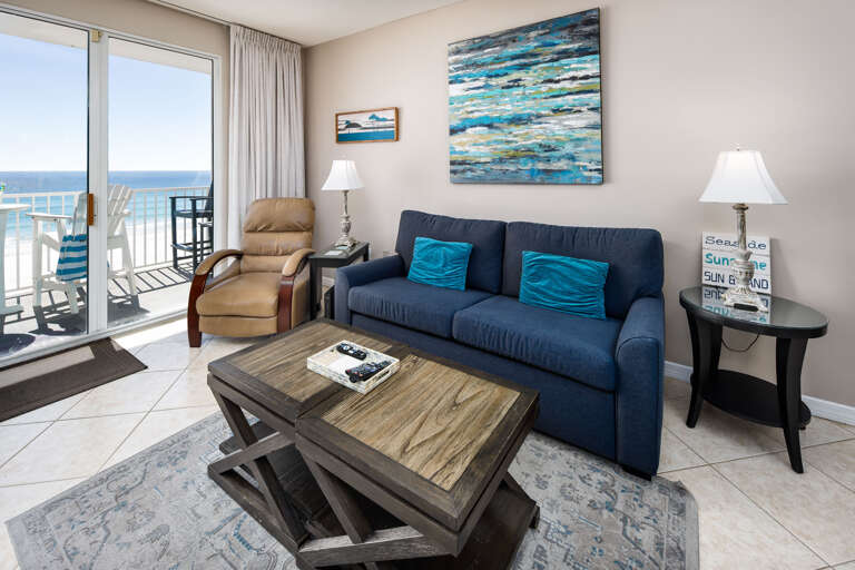 A comfortable sleeper sofa and leather chair are perfect for relaxing and enjoying the view. Check out all the modern touches in this gorgeous living room!