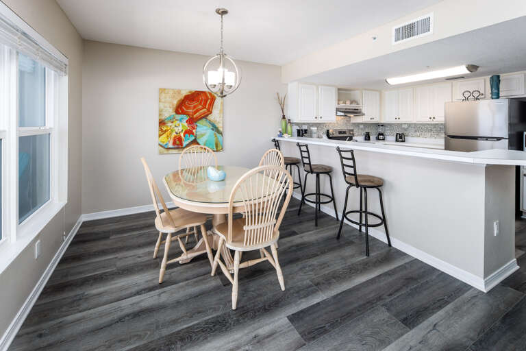 Dining table seats four and additional seating for three at the breakfast bar Dining table seats four and additional seating for three at the breakfast bar