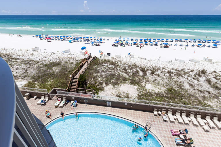 Also pictured is the wooden boardwalk that conveniently gets one from the pool area over the sand dunes and straight to the Gulf!