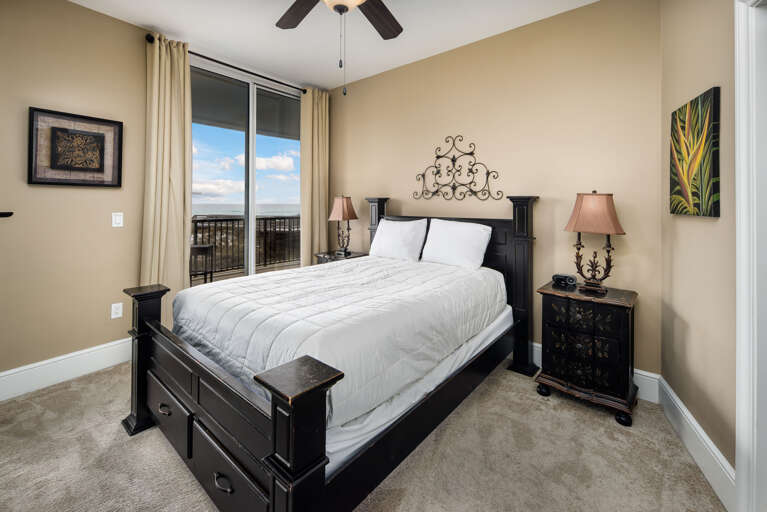 A guest bedroom with balcony access