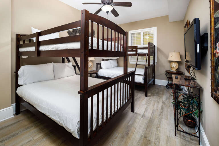 This guest bedroom has two sets of bunk beds and can accommodate 4 guests.