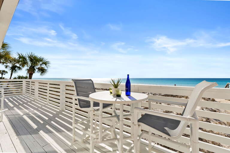 A breezy balcony spans the entire width off the main open living/dining area. A table with comfortable seating allows you to enjoy the gorgeous gulf views over favorite drinks
