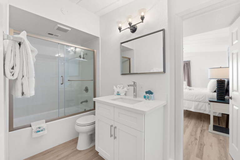 Features a shower/tub combo.