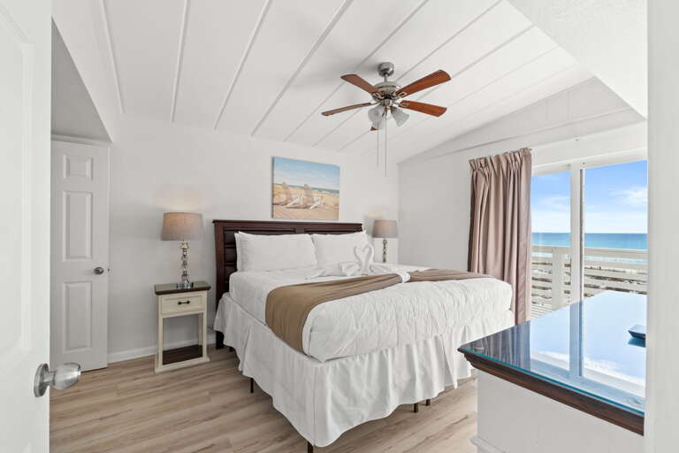 Wake up to the views and sounds of the Gulf! This master features a king size bed and shares a bathroom with a walk in shower with Bedroom #3.