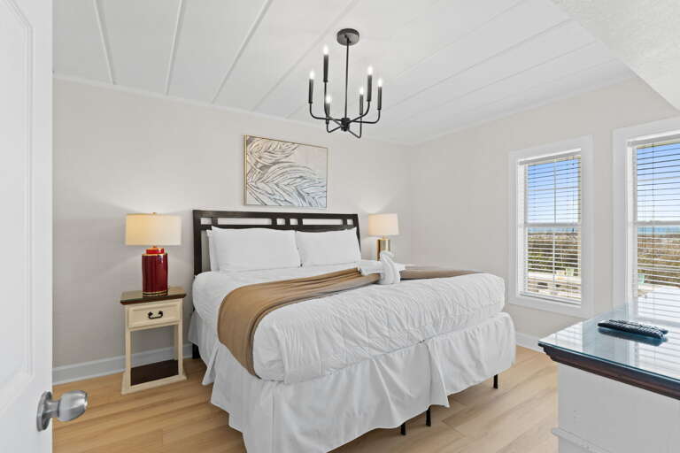 Wake up to the sounds of the Gulf water! This Master features a king size bed and shares a bathroom with a walk in shower with Bedroom #3.