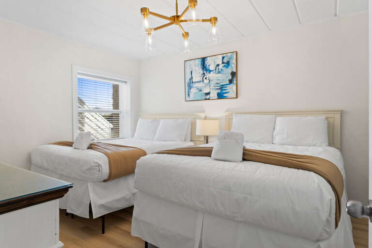 Features two queen beds and shares a bathroom with the 1st master bedroom.