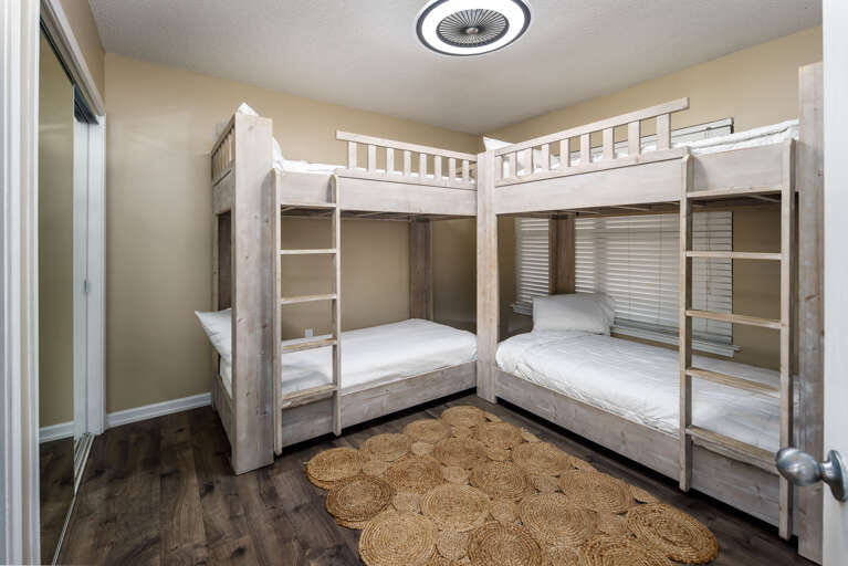 Guest Bedroom with Unique 2 sets of Twin Bunk Beds - perfect for 4 family members or the little ones! 