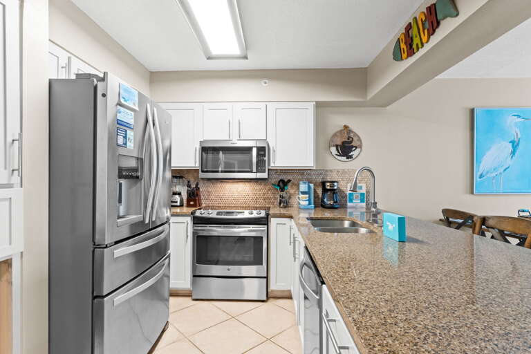 Granite counter tops and stainless steel appliances in this updated kitchen.