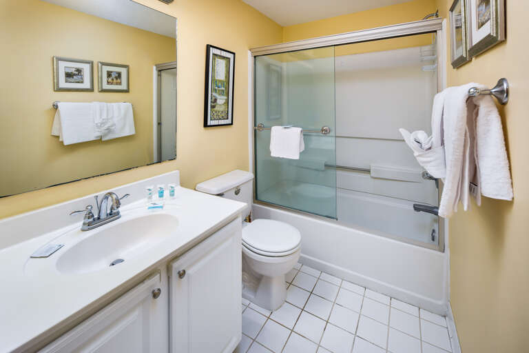 Features shower/bath combo and large vanity with plenty of storage.