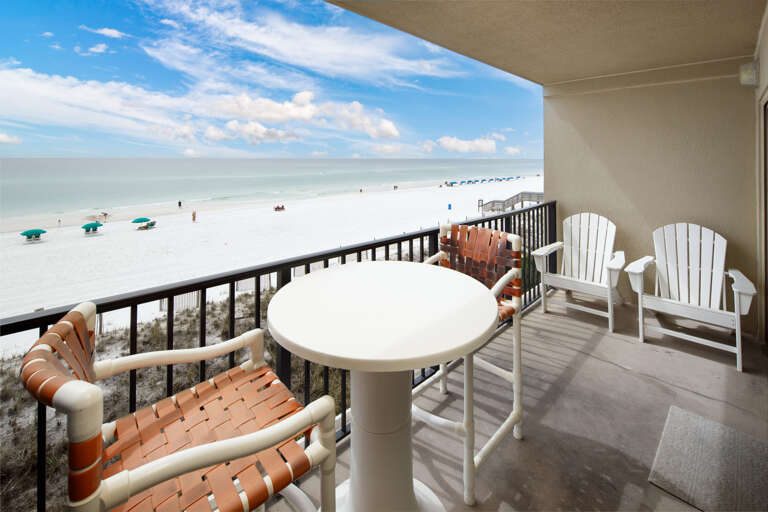 Large beach front balcony with entrances to the living room and master bedroom