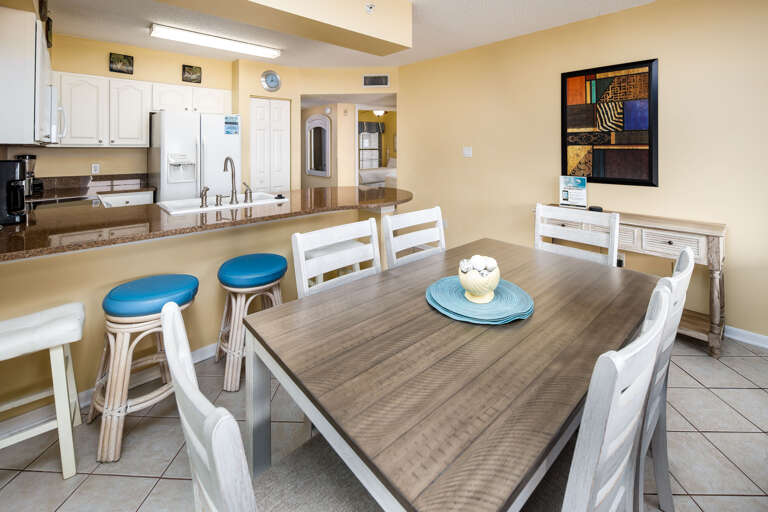 Seating for 6 at the dining table with additional seating at the kitchen island.
