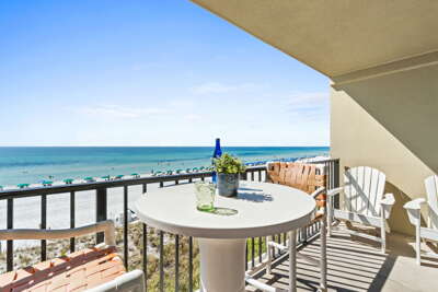 Large beach front balcony with entrances to the living room and master bedroom