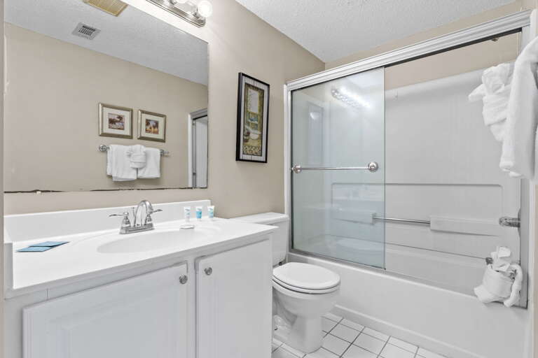 Features shower/bath combo and large vanity with plenty of storage.