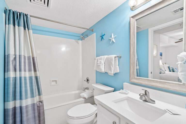 Third Guest Bathroom with it's tranquil colors includes a shower/tub combo.