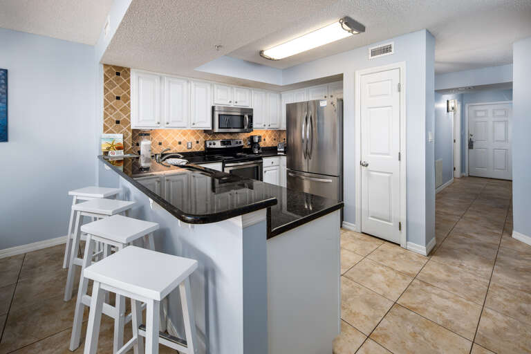 A nice big kitchen with granite counter tops in this unit.  There is 4 additional seats at the breakfast bar. A nice big kitchen with granite counter tops in this unit.  There is 4 additional seats at the breakfast bar.
