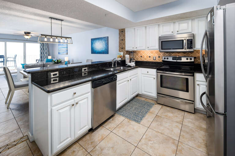 This kitchen is well stocked including stainless steel appliances. Lots of counter space. 
