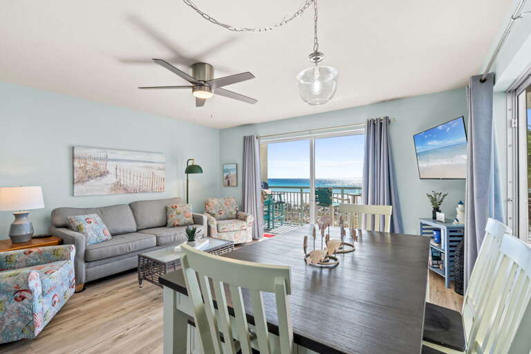 Enjoy this colorful & spacious living room with plenty of seats for everyone and a queen size sleeper sofa.