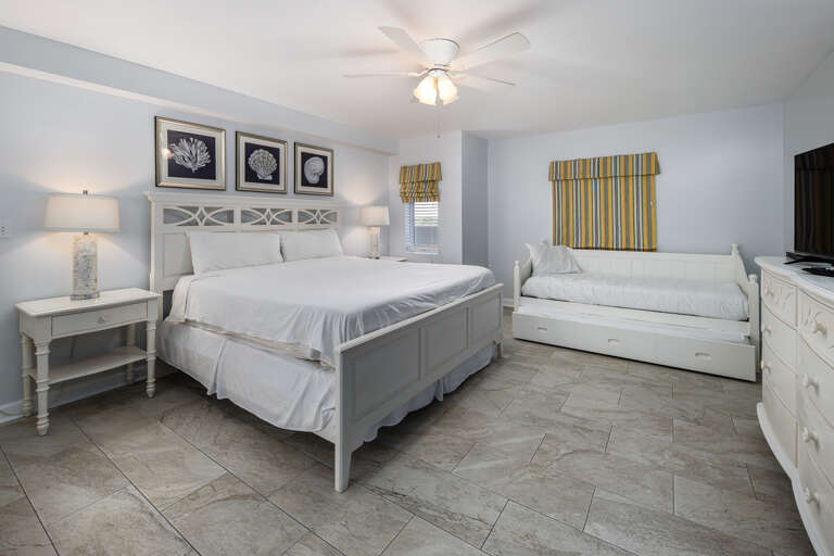VERY spacious master bedroom features a king size bed and a twin bed with trundle!