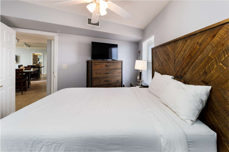 This bedroom has a lot of drawer space & a TV. This bedroom has a lot of drawer space & a TV.