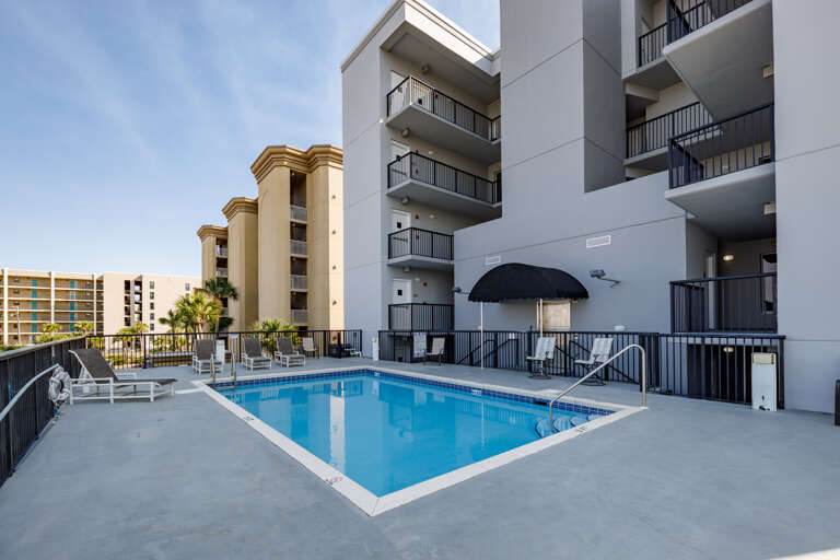 The pool is located on the North side of the building 