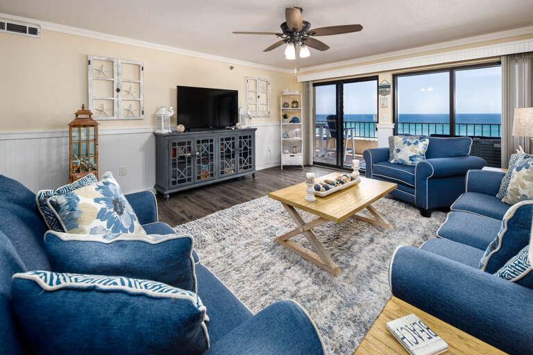 Plenty of seating in the living room with spectacular views of the beach!