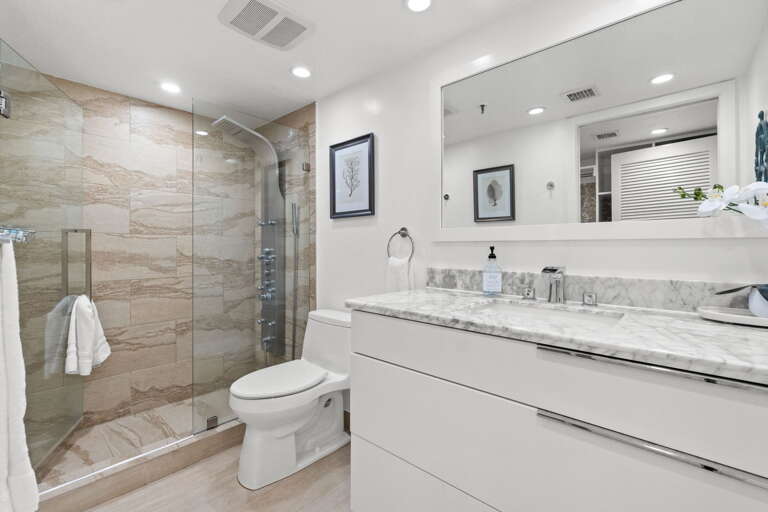 Featuring a walk in shower.
