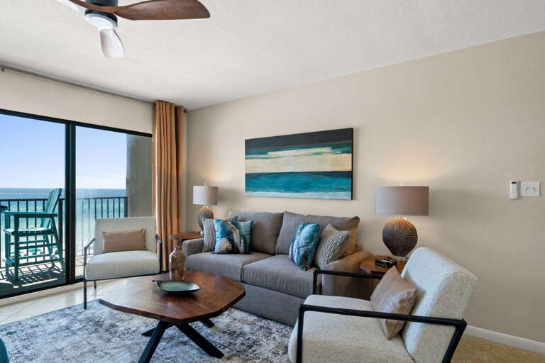 The beach front living room offers superb views! The comfy sofa is a sleeper.
