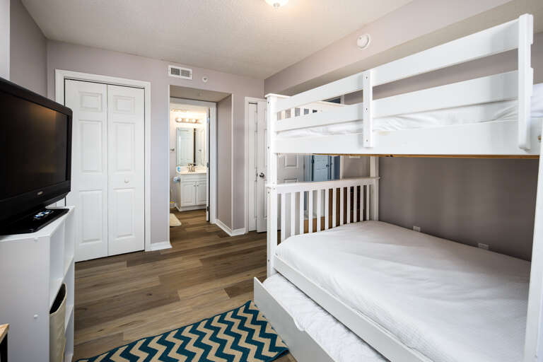 There is a bunk bed set with three beds! 