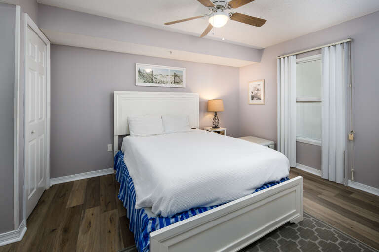 A queen sized bed in this bedroom. 