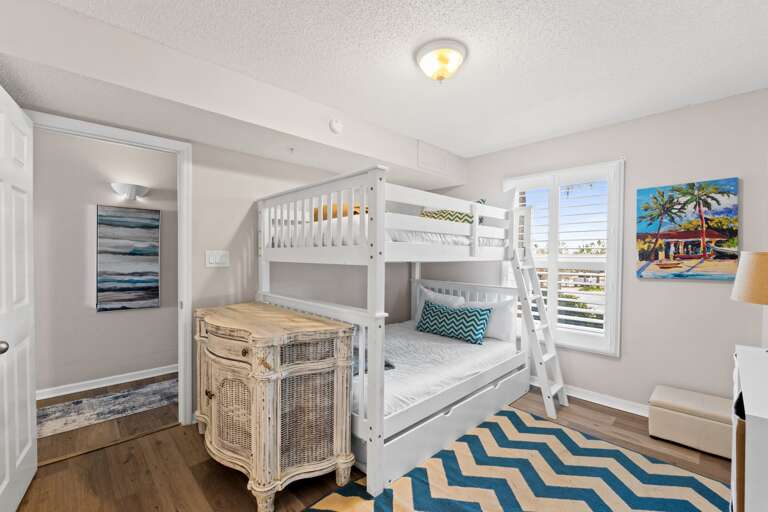 There is a bunk bed set with three beds! 