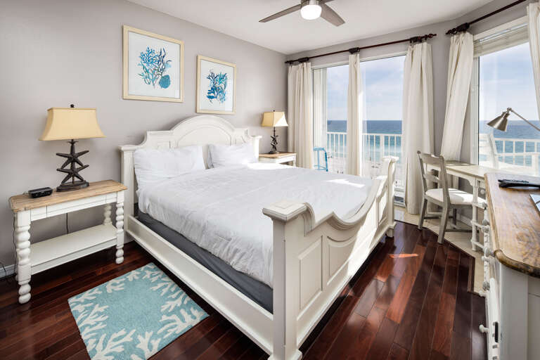 This primary bedroom with a king sized bed also has access to the private balcony- what a view to wake up to every morning!