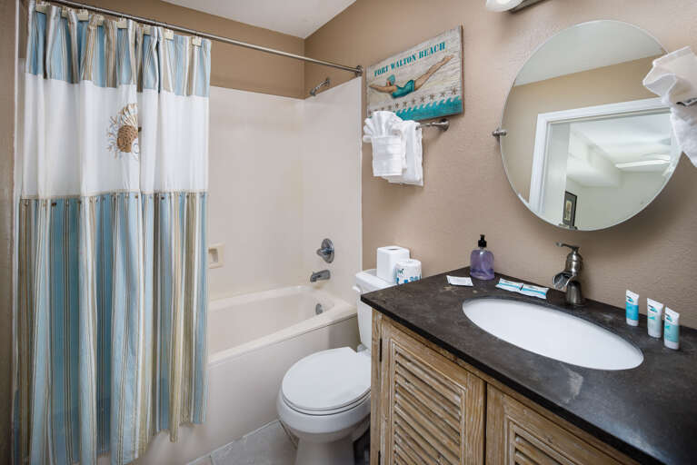 Additional view of a guest bath with a shower/tub combo