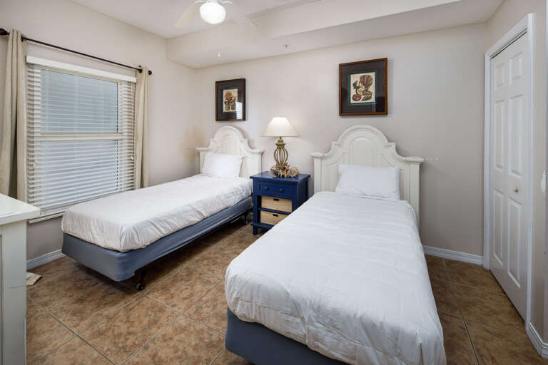 This second guest bedroom has 2 twins and access to a bathroom as well.