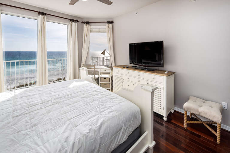 Additional view of the primary bedroom with flat screen television.