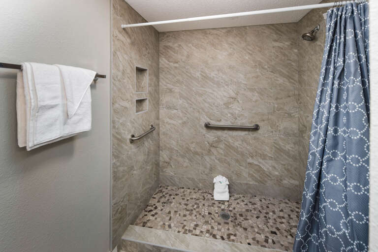 The master bathroom has a walk in shower