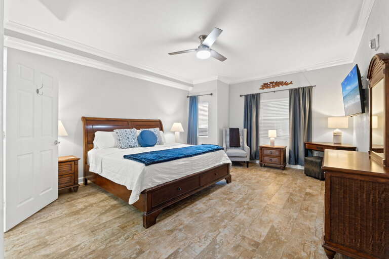 Featuring a king size bed, flat screen TV and a desk.