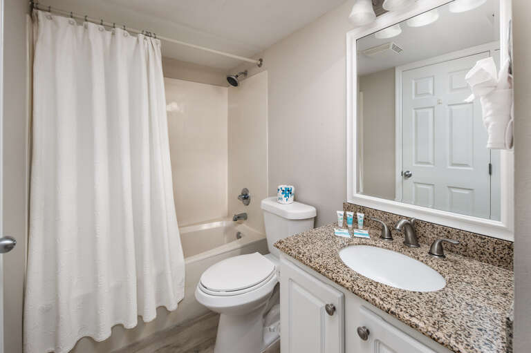 This bath has entry from the hallway and the guest bedroom